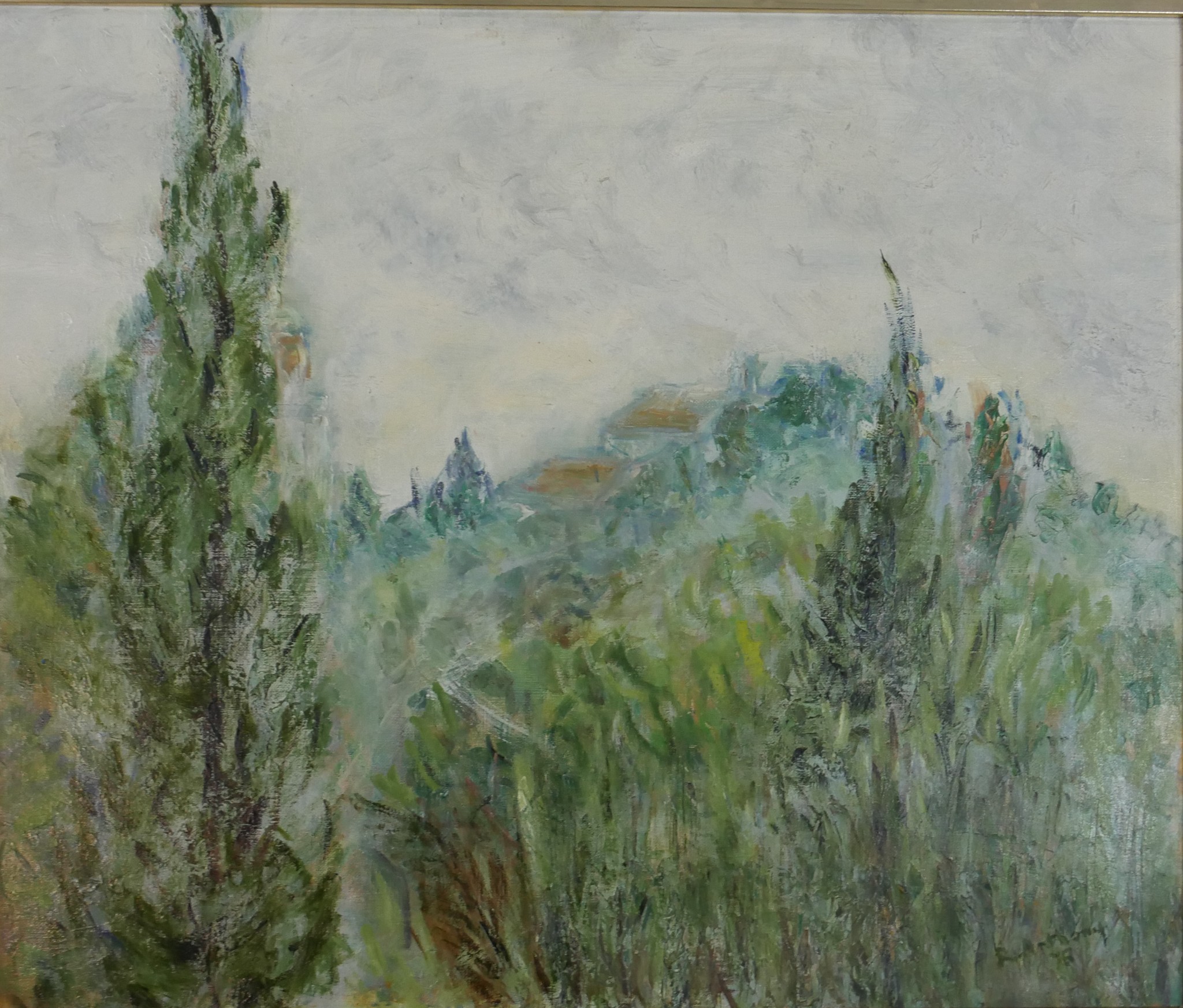 A framed oil on canvas of trees, indistinctly signed and dated 75. H.48 W.57cm