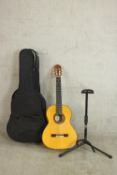 A cased Amalio Burguet acoustic guitar. Model 3F, serial 0329, 2009 with stand.