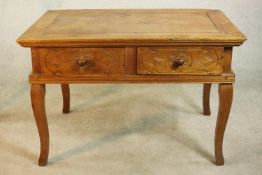 An early 20th century far Eastern hardwood, possibly Narra wood (amboyna) desk