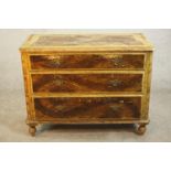 A Victorian painted pine chest, with faux wood grain effect, three long graduated drawers on
