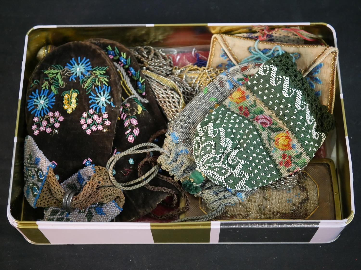 A collection of twelve antique hand beaded and embroidered bags each with a different design and - Image 3 of 9