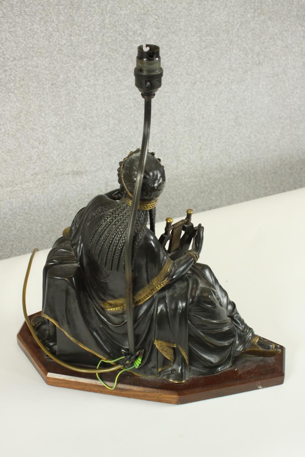 An Egyptian revival gilded bronze figural table lamp depicted as a female in flowing robes holding a - Image 7 of 7
