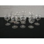 A set of twelve Victorian engraved stemmed glasses with horizontal line detailing. H.12 Dia.7cm.