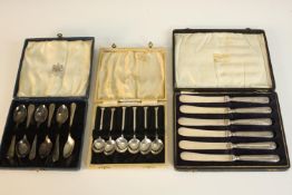 Three leather cased boxes of silver plate cutlery, including a set of six Art Deco coffee spoons