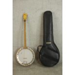 A Framus four string banjo in soft carry case..