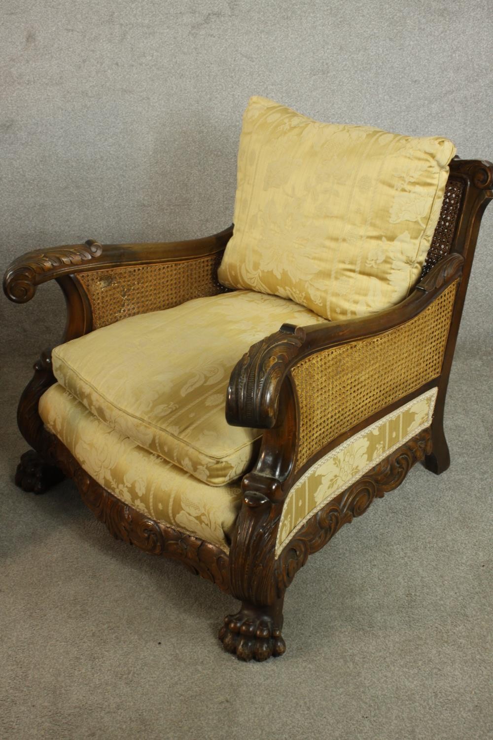 A pair of early 20th century Continental carved walnut bergere armchairs, upholstered in gold - Image 7 of 30