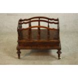 A Victorian figured walnut Canterbury, with lyre ends, the dividers with turned supports, on