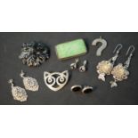 A collection of silver jewellery, including a animal face brooch (Hallmarked: RSE, London), a pair