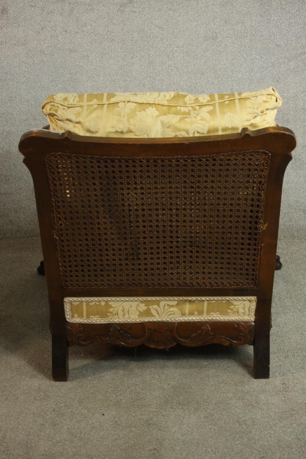 A pair of early 20th century Continental carved walnut bergere armchairs, upholstered in gold - Image 13 of 30