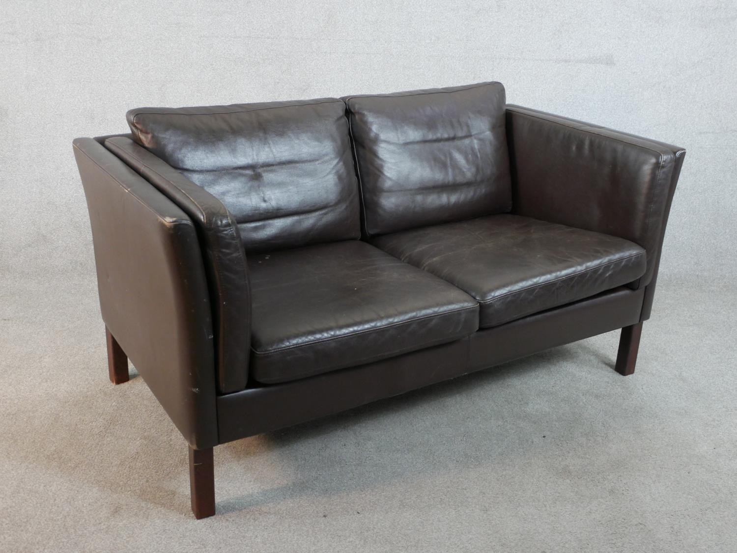 A 1970s Danish style two seater sofa, upholstered in dark brown leather, on square section legs. H. - Image 5 of 5