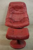 A late 20th century Stressless style scarlet leather reclining armchair with padded arms on a