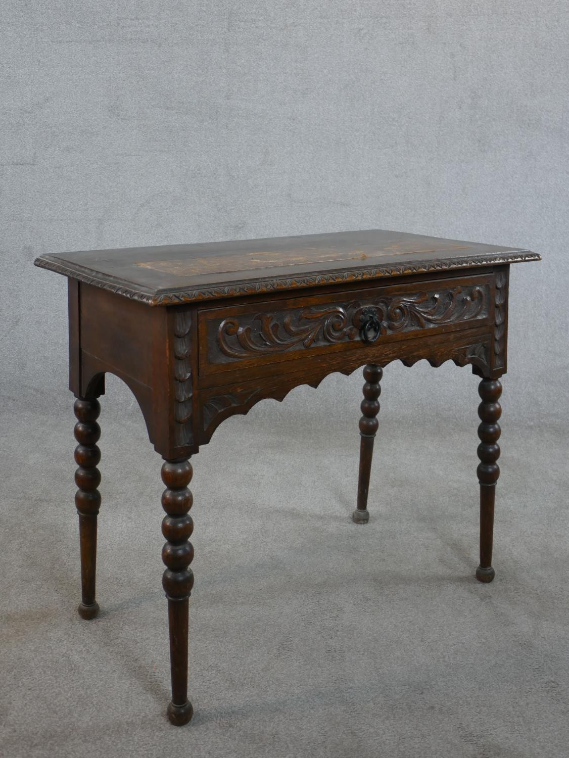 A Victorian carved oak lowboy, the top with a brown leather insert and a carved moulded edge over - Image 7 of 8