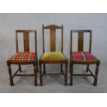 A pair of early 20th century oak dining chairs, together with a similar chair, each with drop in