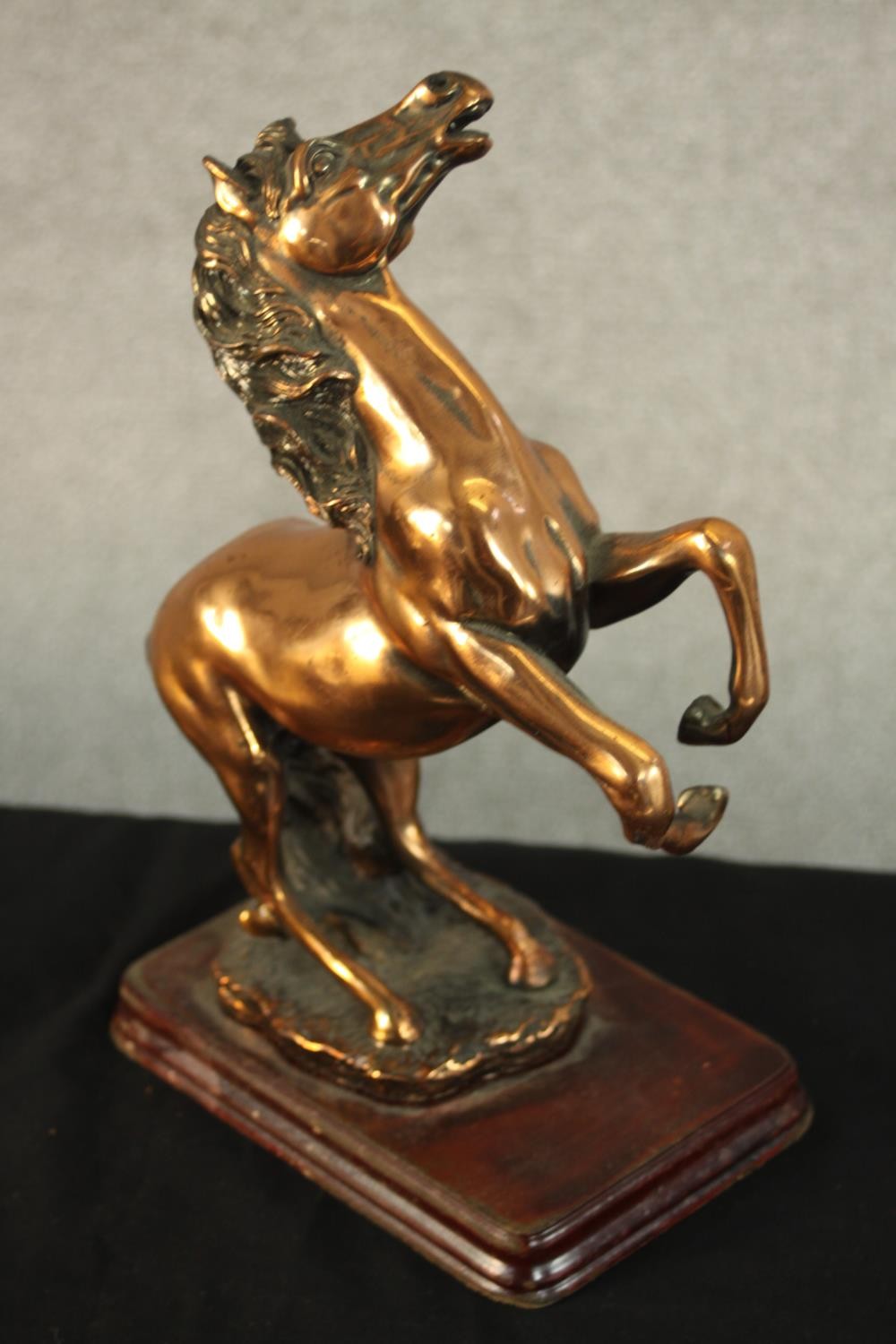 An early 20th century copper rearing horse on a mahogany base along with another brass rearing horse - Image 6 of 10