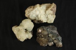 A collection of three quartz and smoky quartz crystal pieces. H.10 W.7 D.5cm. (largest)