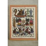 A framed and glazed South American hand embroidered woollen wall hanging depicting boats, birds