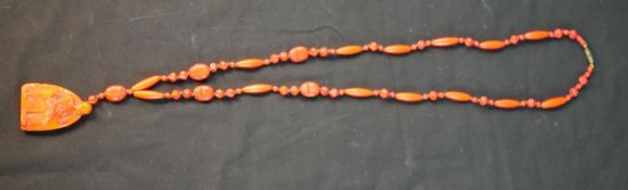 A Max Neiger style Egyptian revival Czech red/orange pressed glass scarab bead necklace with