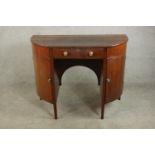 An unusual 19th century walnut bow fronted kneehole sideboard, with a single drawer flanked by