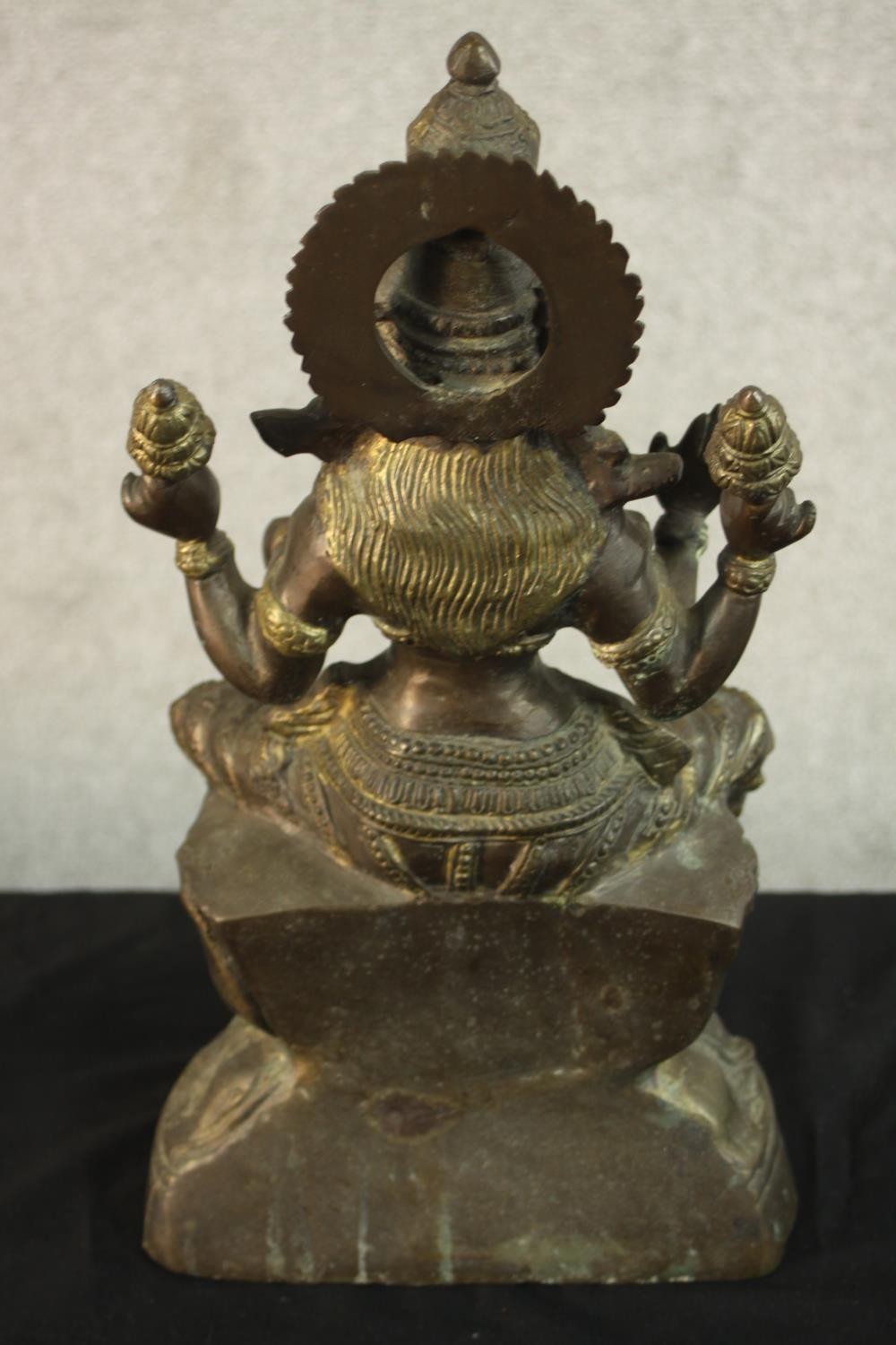 An early 20th century brass figure of the Indian deity Lakshmi on a lotus form base. (Damaged.) H.43 - Image 7 of 9