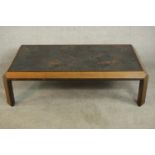 An unusual G-Plan teak coffee table of square form with a weathered effect top, label to the