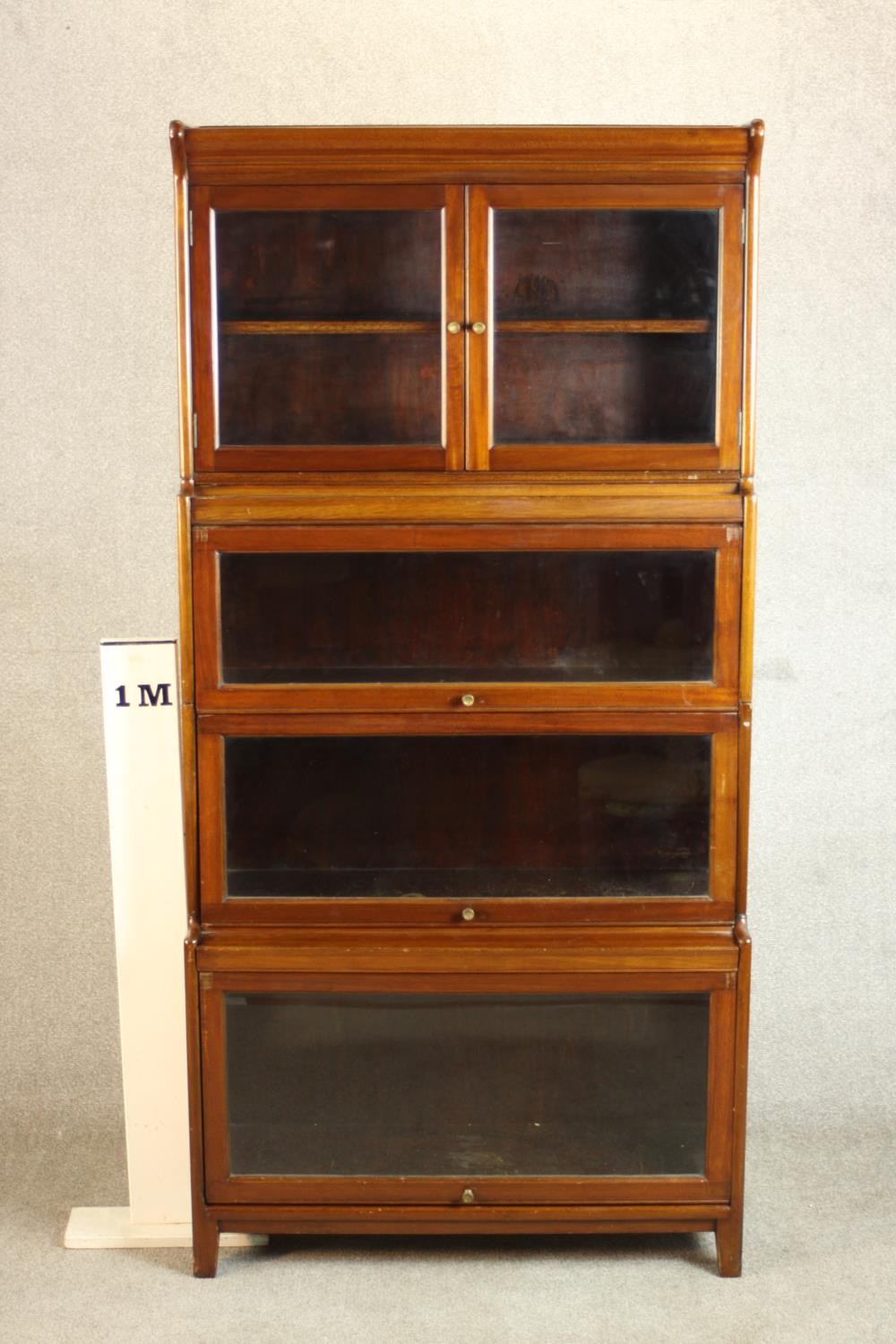 A mid 20th century mahogany Gumm stacking bookcase, with two glazed cupboard doors over three - Image 2 of 16