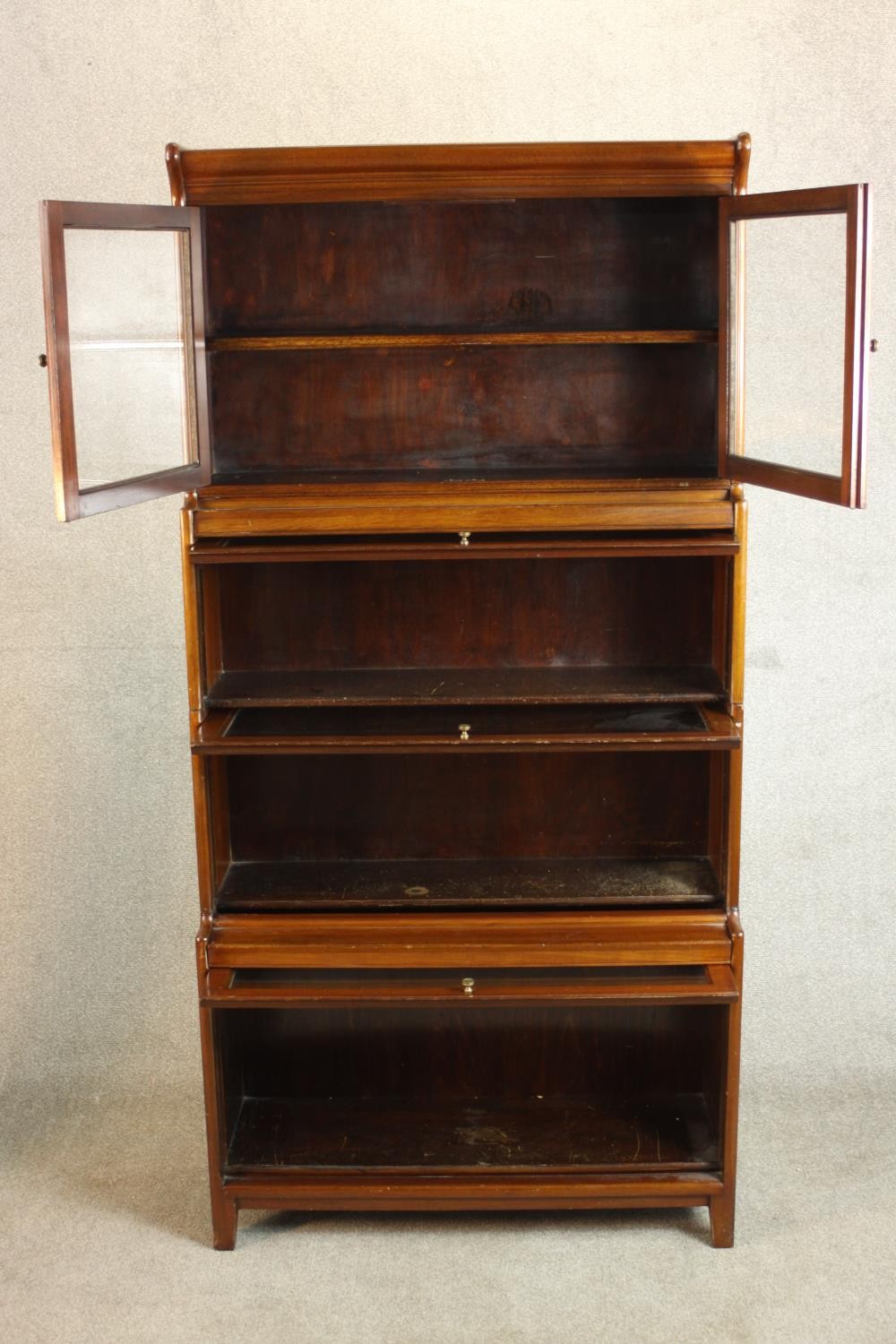 A mid 20th century mahogany Gumm stacking bookcase, with two glazed cupboard doors over three - Image 6 of 16