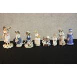 A collection of eight hand painted porcelain figures, makers include Lladro, Nao and Royal Crown