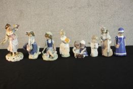 A collection of eight hand painted porcelain figures, makers include Lladro, Nao and Royal Crown