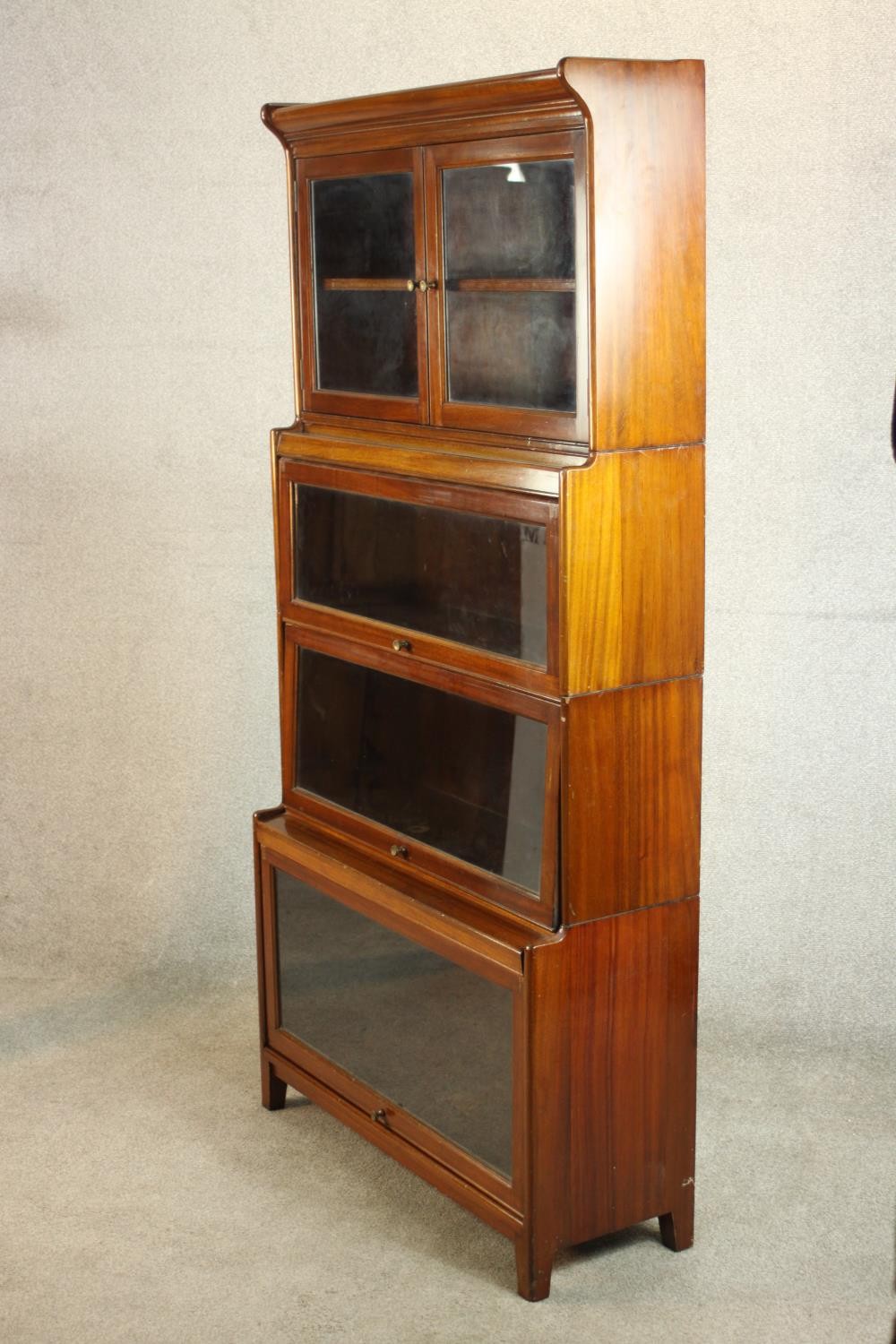 A mid 20th century mahogany Gumm stacking bookcase, with two glazed cupboard doors over three - Image 8 of 16