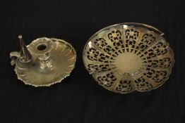 A silver plated chamber stick with snuffer along with a pierced silver plated basket. H.5 Dia.