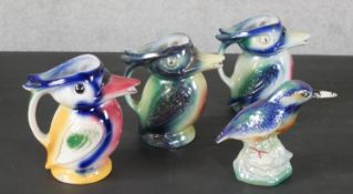 Three vintage lustre-ware kingfisher jugs along with a lustre-ware kingfisher on rock form base. H.