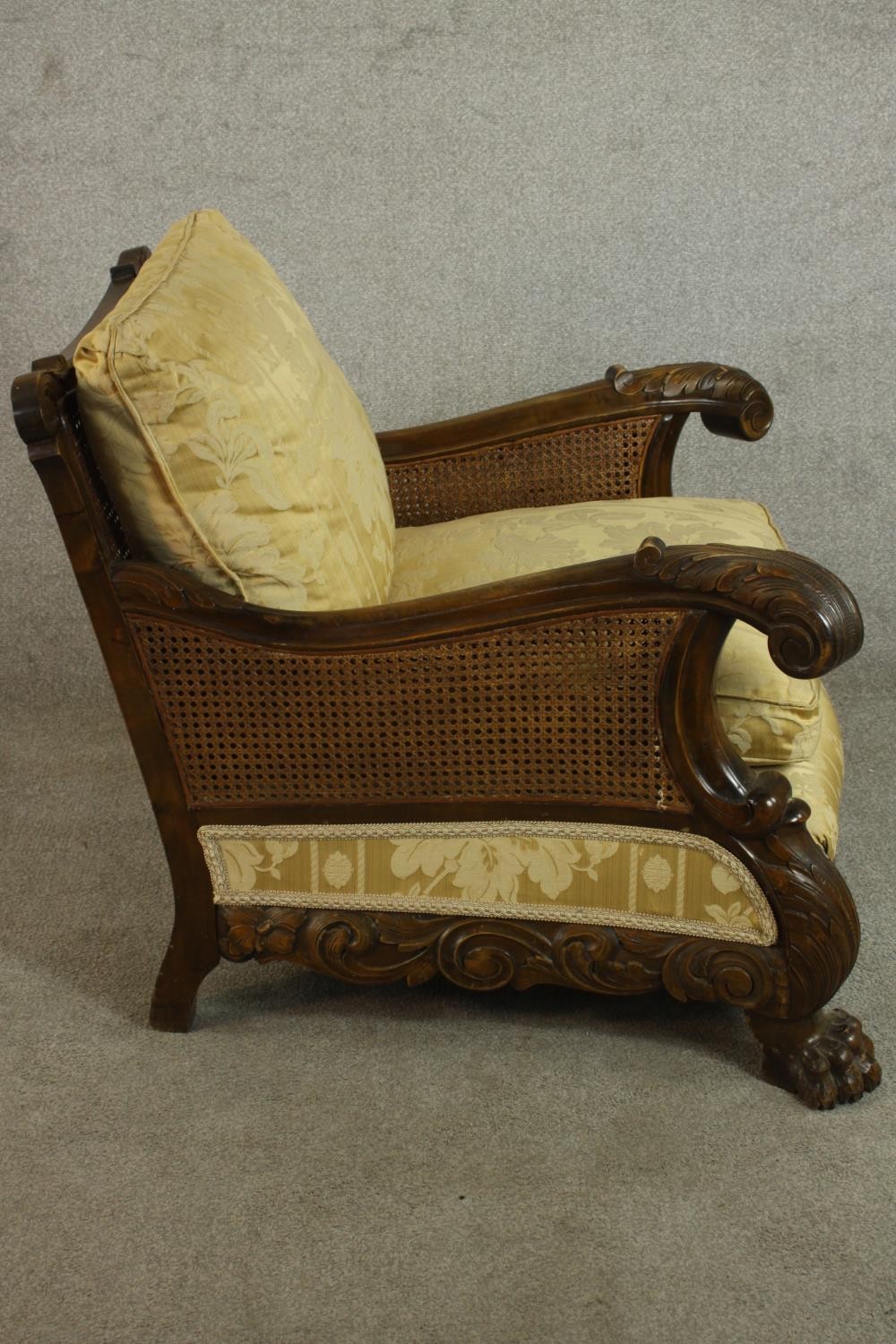 A pair of early 20th century Continental carved walnut bergere armchairs, upholstered in gold - Image 21 of 30