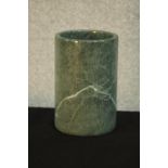 A carved and polished green and white veined marble brush pot. H.18 Dia.12cm.