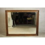 A late 19th/early 20th century oak framed rectangular wall mirror. H.109 W.133cm.