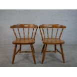 A pair of 20th century beech kitchen chairs, with spindle back, over turned legs joined by turned