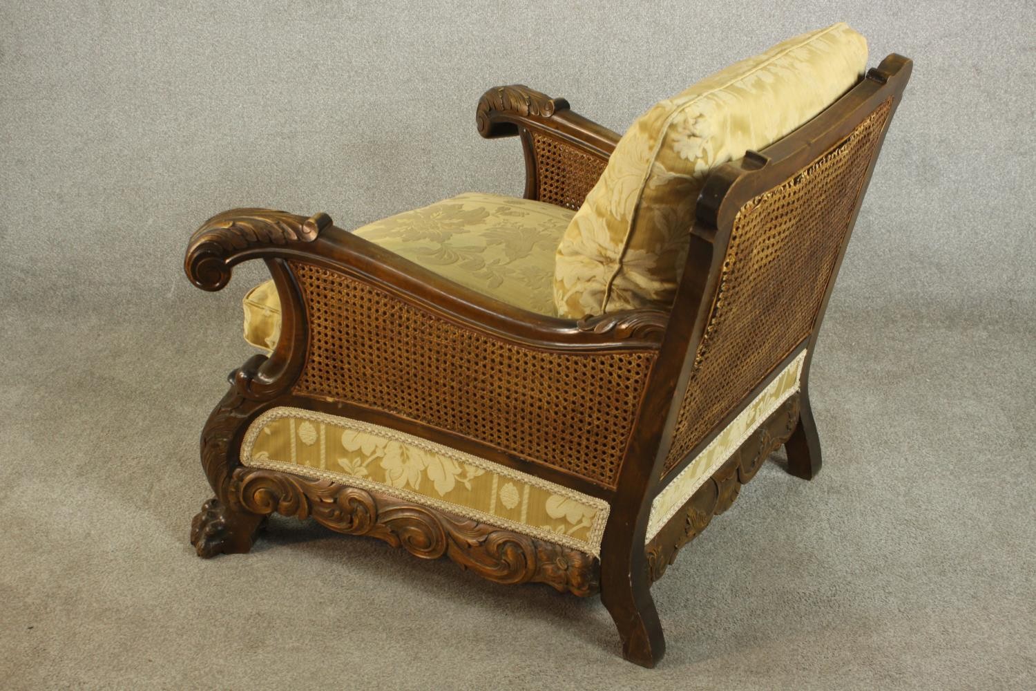 A pair of early 20th century Continental carved walnut bergere armchairs, upholstered in gold - Image 25 of 30