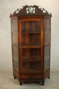 An early 20th century far Eastern hardwood, possibly Narra wood (amboyna) display cabinet.