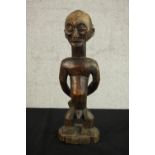 A 19th century Luba / Hemba, Congo, African carved slave ancestor figure. The portrayal with bound