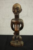 A 19th century Luba / Hemba, Congo, African carved slave ancestor figure. The portrayal with bound