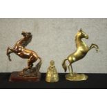 An early 20th century copper rearing horse on a mahogany base along with another brass rearing horse