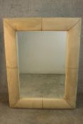 A contemporary rectangular mirror in a cream faux suede cushion frame. H.122 W.190