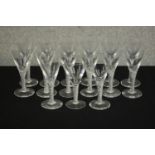 A set of fifteen clear glass air twist stem sherry glasses. H.15 Dia.6cm. (largest)