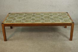 A circa 1970s simulated rosewood coffee table, the rectangular top set with twenty one tiles in hues