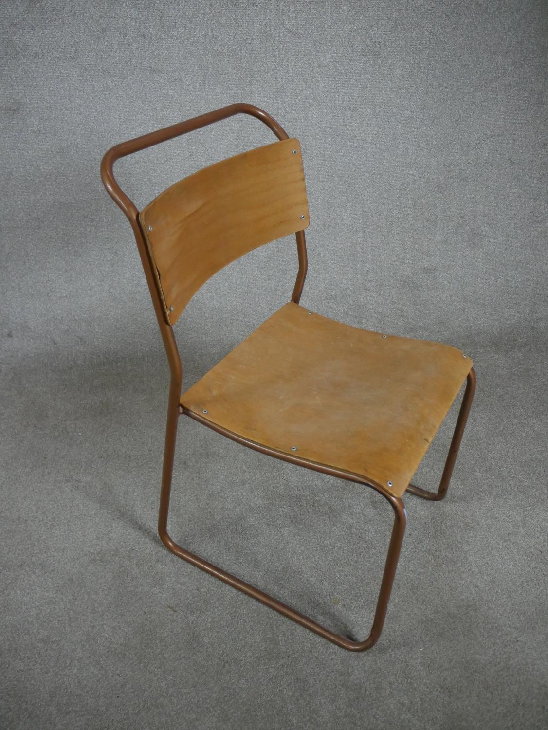 A set of four 1950s Redro plywood stacking school chairs, on brown painted tubular frames. H.84 W.44 - Image 4 of 6