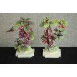 A pair of Royal Worcester hand painted models of Ruby Throated Hummingbirds on Fuschia by Dorothy