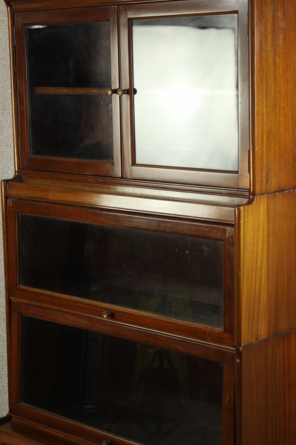 A mid 20th century mahogany Gumm stacking bookcase, with two glazed cupboard doors over three - Image 12 of 16