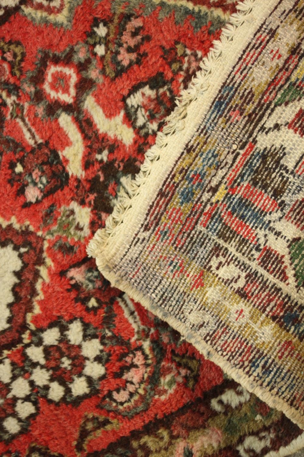 A hand woven red Persian Hamadan with central medallion on burgundy ground within spandrels and - Image 5 of 5