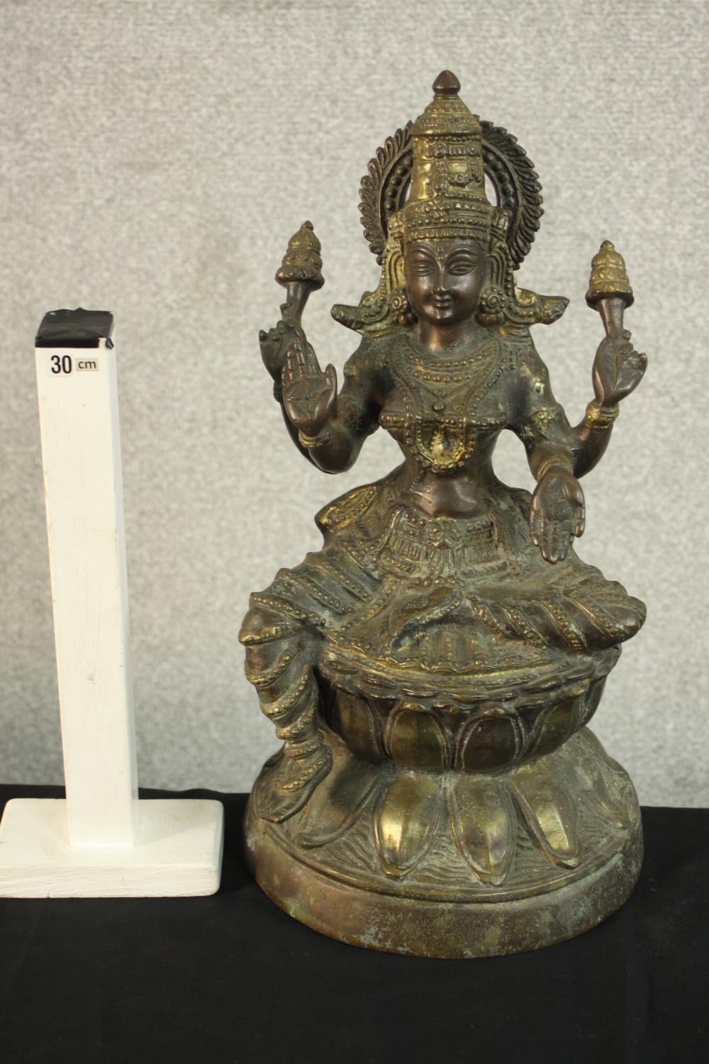 An early 20th century brass figure of the Indian deity Lakshmi on a lotus form base. (Damaged.) H.43 - Image 2 of 9