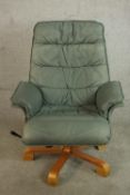 A late 20th century Scandinavian Stressles style grey/blue leather chair with footstool, the chair