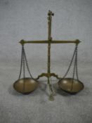 A set of 19th century brass weighing scales. H.50 W.50 D.30cm.